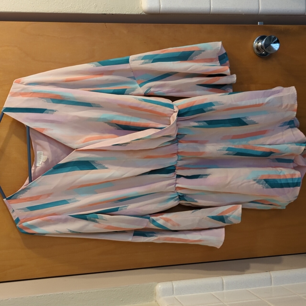 Pink & detailed romper by Decree